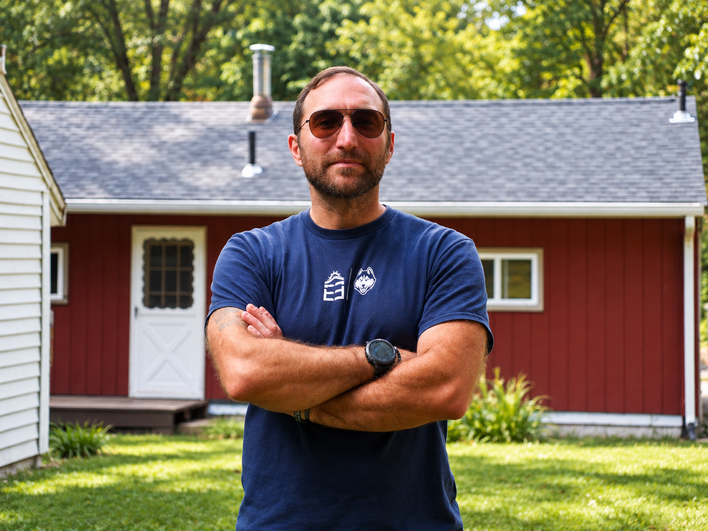 Jason DeAngelis in front of his completed new roof